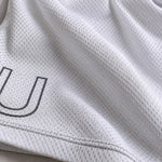 Gros plan sur le tissu du short Blue Lock Ubers